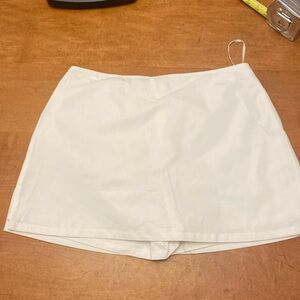 Princess Polly white low rise Gigi skort.